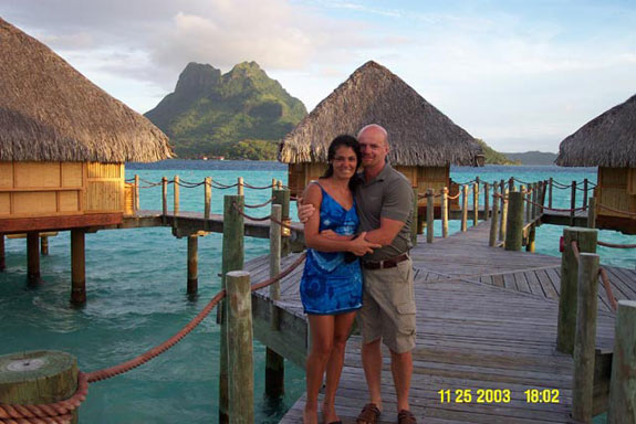 Christian dating site owner cuddles his wife in beautiful Bora Bora