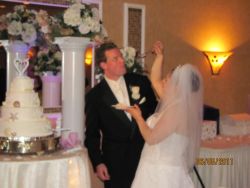 Alyssa feeds Bill some wedding cake