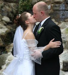 Michigan Christian singles now married kiss on their wedding day