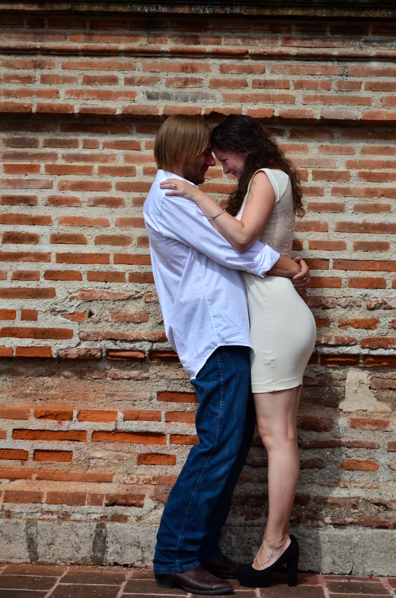 Christian singles hugging by a wall