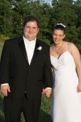 Newly married Christians laugh and hold hands