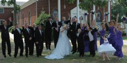 Funny photo of wedding party trying to time celebration jump