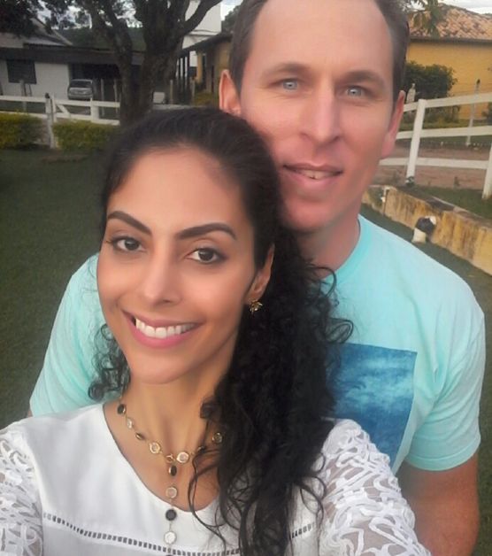 Beautiful Christian singles stand close to each other and smile for selfie