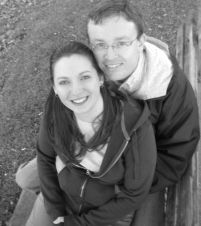 Newly engaged Georgian Christians sit and hug on a park bench