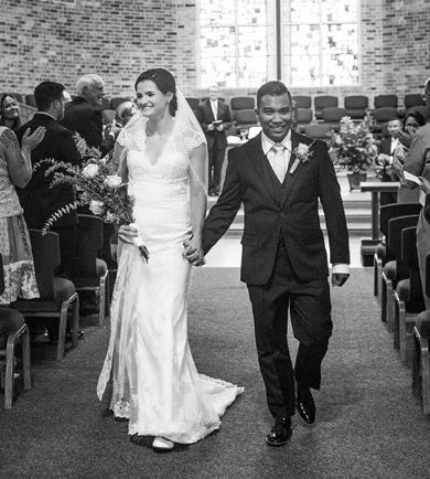 Pennsylvania Christian singles just fit together as they walk down the aisle smiling and holding hands after marrying at church