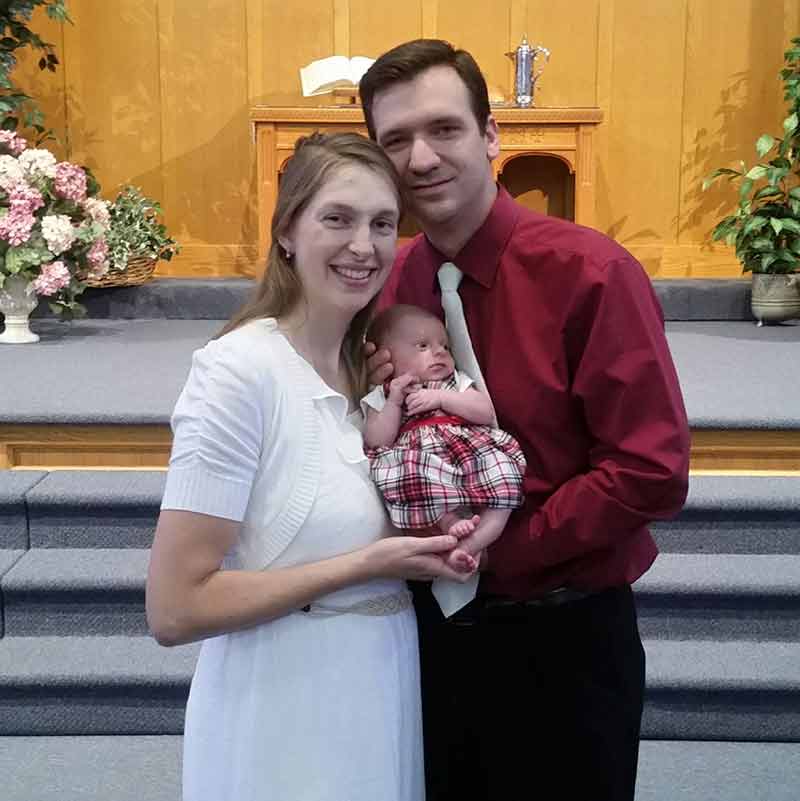 Christian couple at baby dedication at church