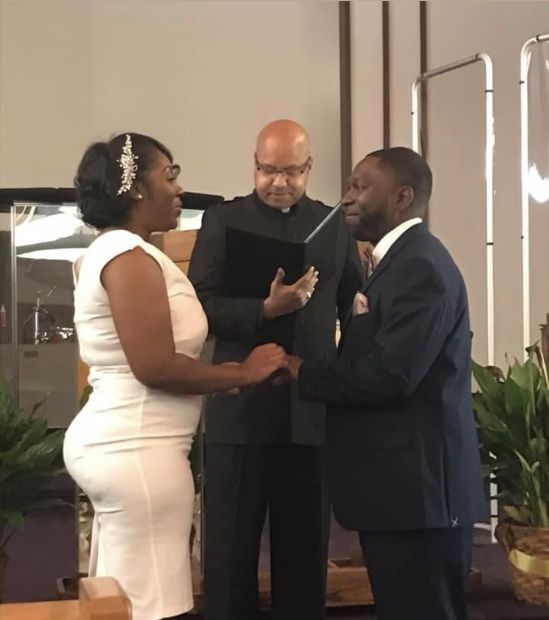Christian single from Michigan in white marrying former Christian single from Ohio who is dressed black suit