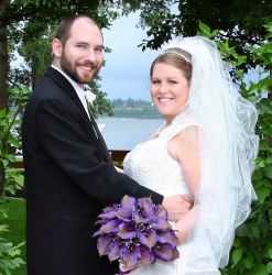 Young Christian Missionaries marry in beautiful outdoor setting while smiling and holding each other