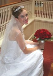 A radiant bride looks beautiful in white holding her flowers