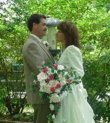 Newlywed Christians hold each other and gaze lovingly