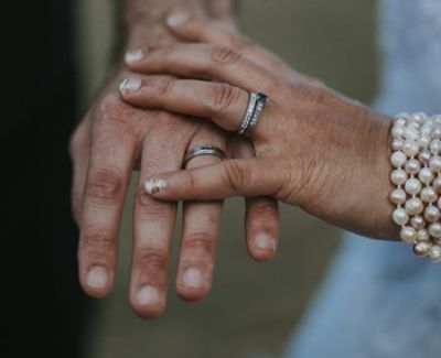 Wedding rings on display from proud newlyweds