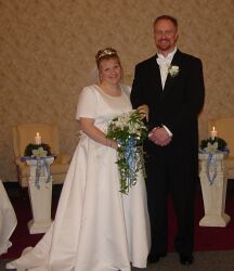 Single parent finds love at the altar and beams joyfully as he stands arm in arm with his new bride