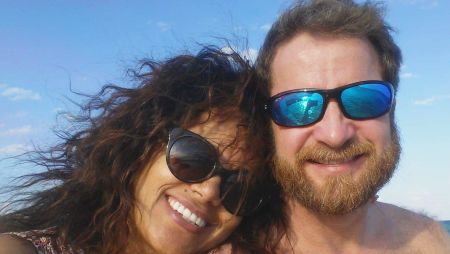 Beach photo for couple wearing sunglasses