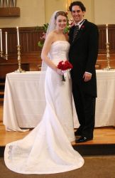 Proud Christians pose at the altar after marrying