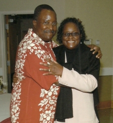 A thrilled woman hugs her smiling husband