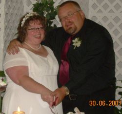 A couple overwhelmed with joy hug on their wedding day