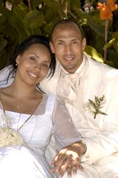 A very happy and relaxed bride leans against her new husband