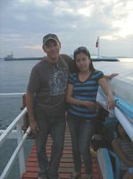 BC Christian man engaged and poses on a pier with his new fiancee
