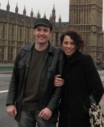 Christian couple expecting first child huddle together in London