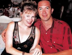Christian couple hug at dinner on a cruise ship