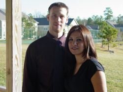 Cute Christian couple smile on the porch