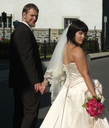 Bride and groom Looking back as they walk away