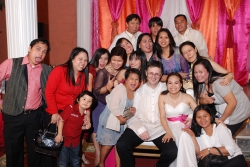 Silly family pose with lots of laughter at a wedding