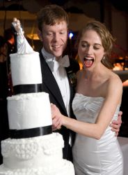 The wedding cake nearly topples over with Nicole's excitement
