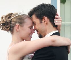Marital bliss for Christian couple who hug closely and prepare to kiss