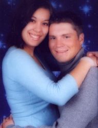 Joyful Christian couple hug on their 1st anniversary and look very comfortable together