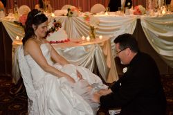 A groom checks if the Cinderella shoe fits his bride