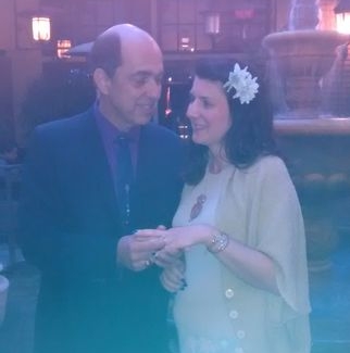 Smiling California Christian puts wedding ring on his new California bride
