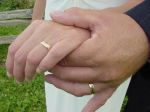 Christian couple show off their wedding rings