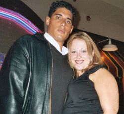 Christian single patiently seeks out great guy. Smiling woman standing next to a tall handsome man