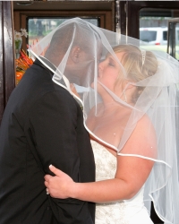 A passionate kiss between two formerly single Maryland Christians on their wedding day