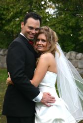 Melina holds on tight to her new husband