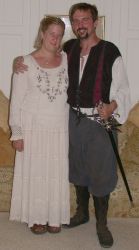Christian singles in Renaissance clothes smile together