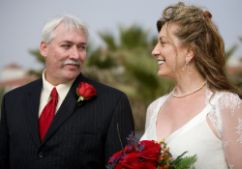 Senior Christians no longer single are shown smiling at each other on their relaxed wedding day