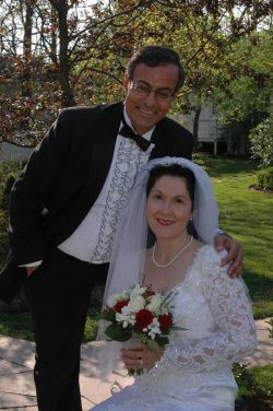 Former single from Ontario leans over and puts his arm around his beautiful bride