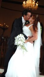 Former Australian single Christians now married kiss on their wedding day