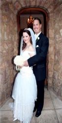 Beautiful wedding setting as newly married couple hug