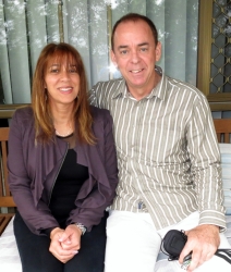 Very happy Christian couple sitting close together and smiling