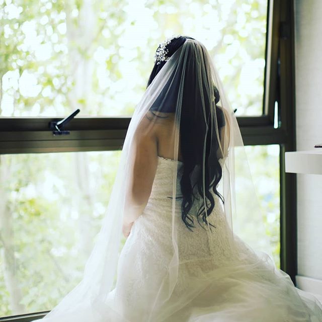 Bride looks out window on last day of being single