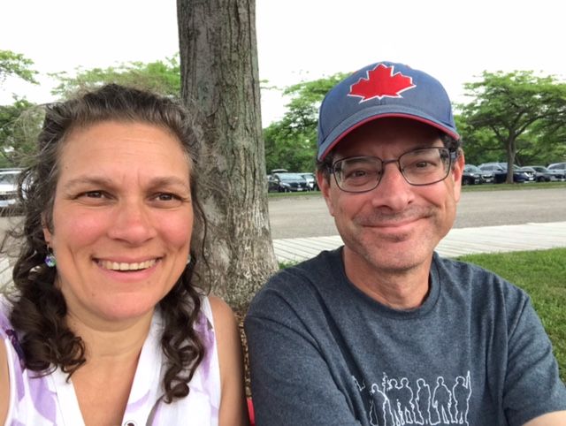 Christian singles smile together while comfortably enjoying a day out in the summer