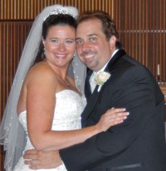 Happiest day ever for newly married Christians who hug and look very comfortable together