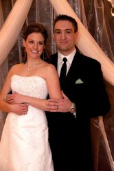An ecstatic ex-single from Alberta looks radiant as she poses with a handsome man on their wedding day