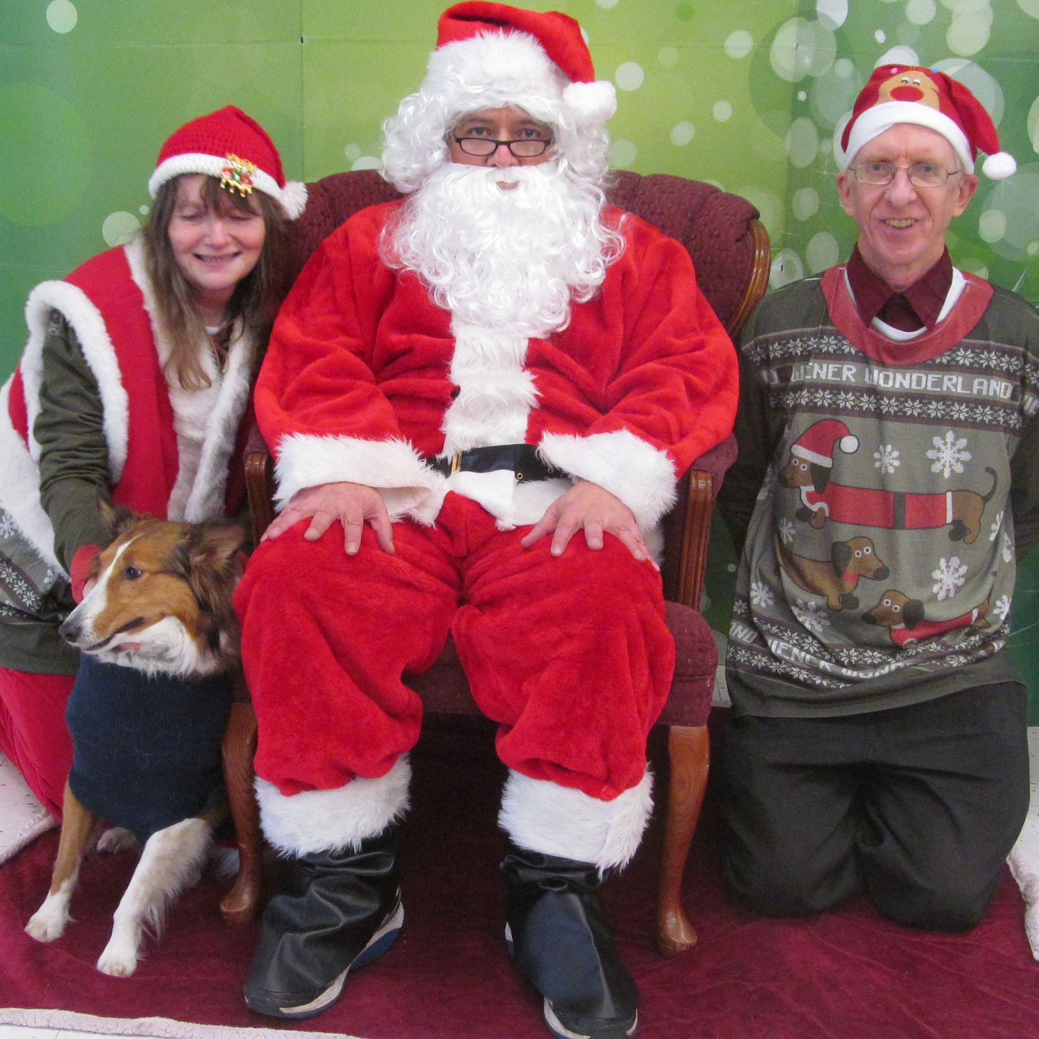Couple sitting next to Santa Claws
