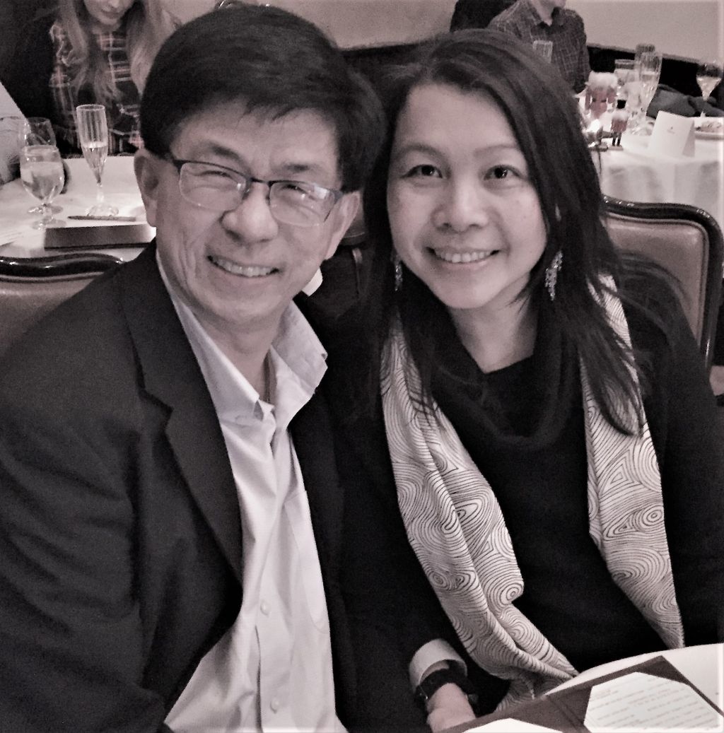 Joyful Christian couple smiling while dressed up for dinner