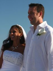 A tall Christian man from California stands next to his beautiful and joy filled bride
