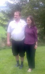 Terje and Raluca on the grass full of joy